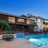a building view with swimming pool in front of it