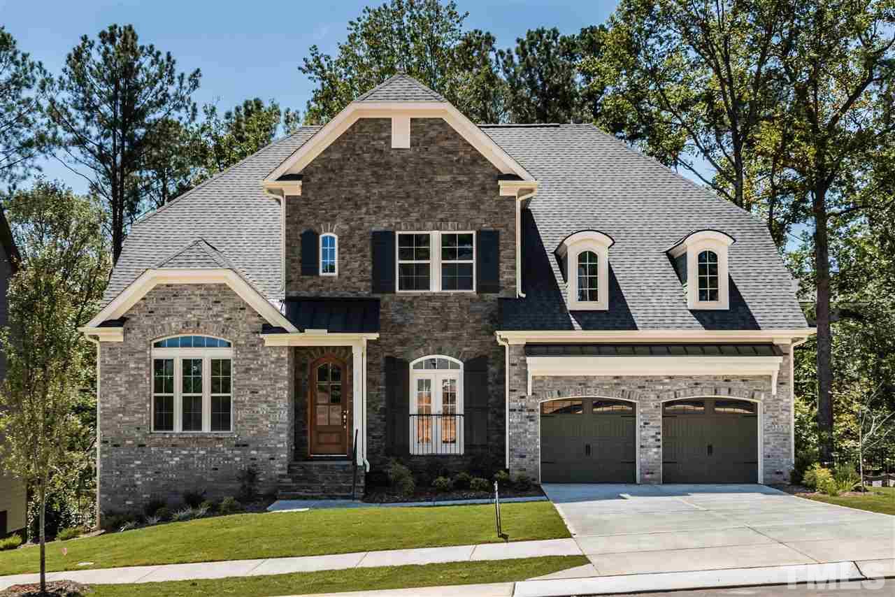 5273 Aleppo Lane, Unit 5 Raleigh, NC 27613 - Photo 1 of 24 a front view of a house with a yard
