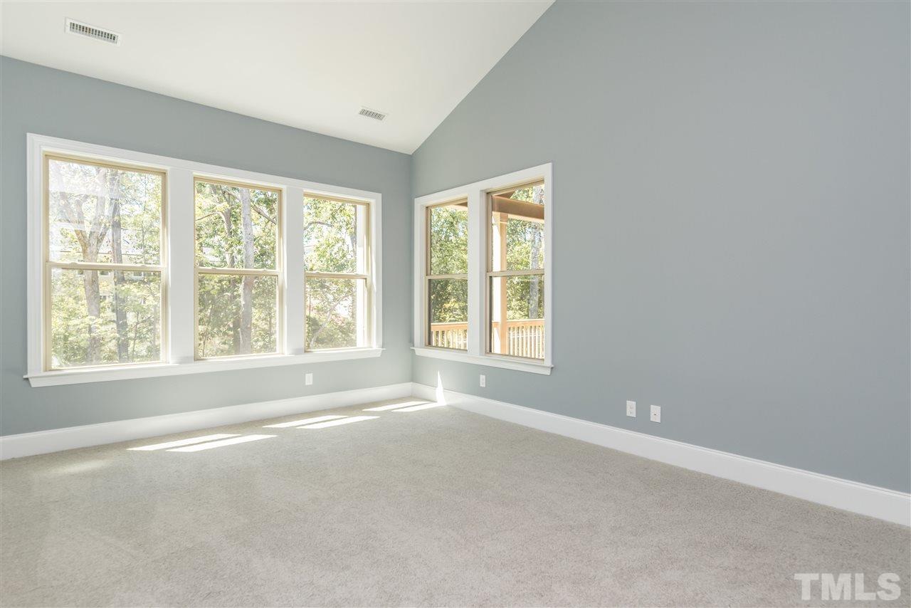 5273 Aleppo Lane, Unit 5 Raleigh, NC 27613 - Photo 11 of 24 a view of a big room with windows and chandelier fan