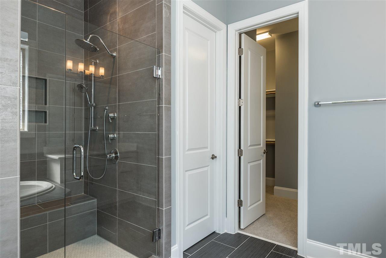 5273 Aleppo Lane, Unit 5 Raleigh, NC 27613 - Photo 13 of 24 a bathroom with a shower and a sink