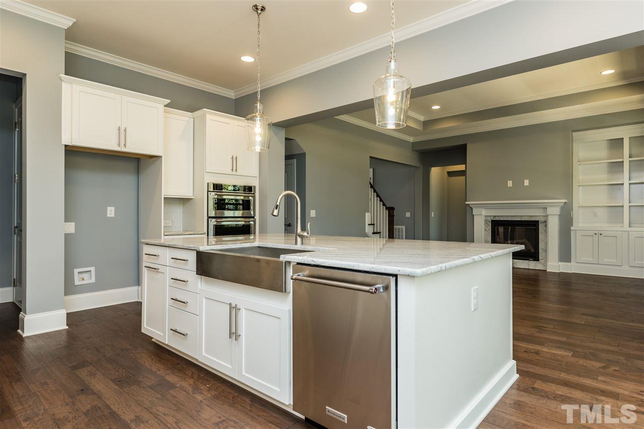 5273 Aleppo Lane, Unit 5 Raleigh, NC 27613 - Photo 7 of 24 a kitchen with a stove and a refrigerator