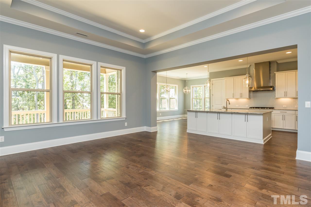 5273 Aleppo Lane, Unit 5 Raleigh, NC 27613 - Photo 9 of 24 a view of an empty room with window and wooden floor