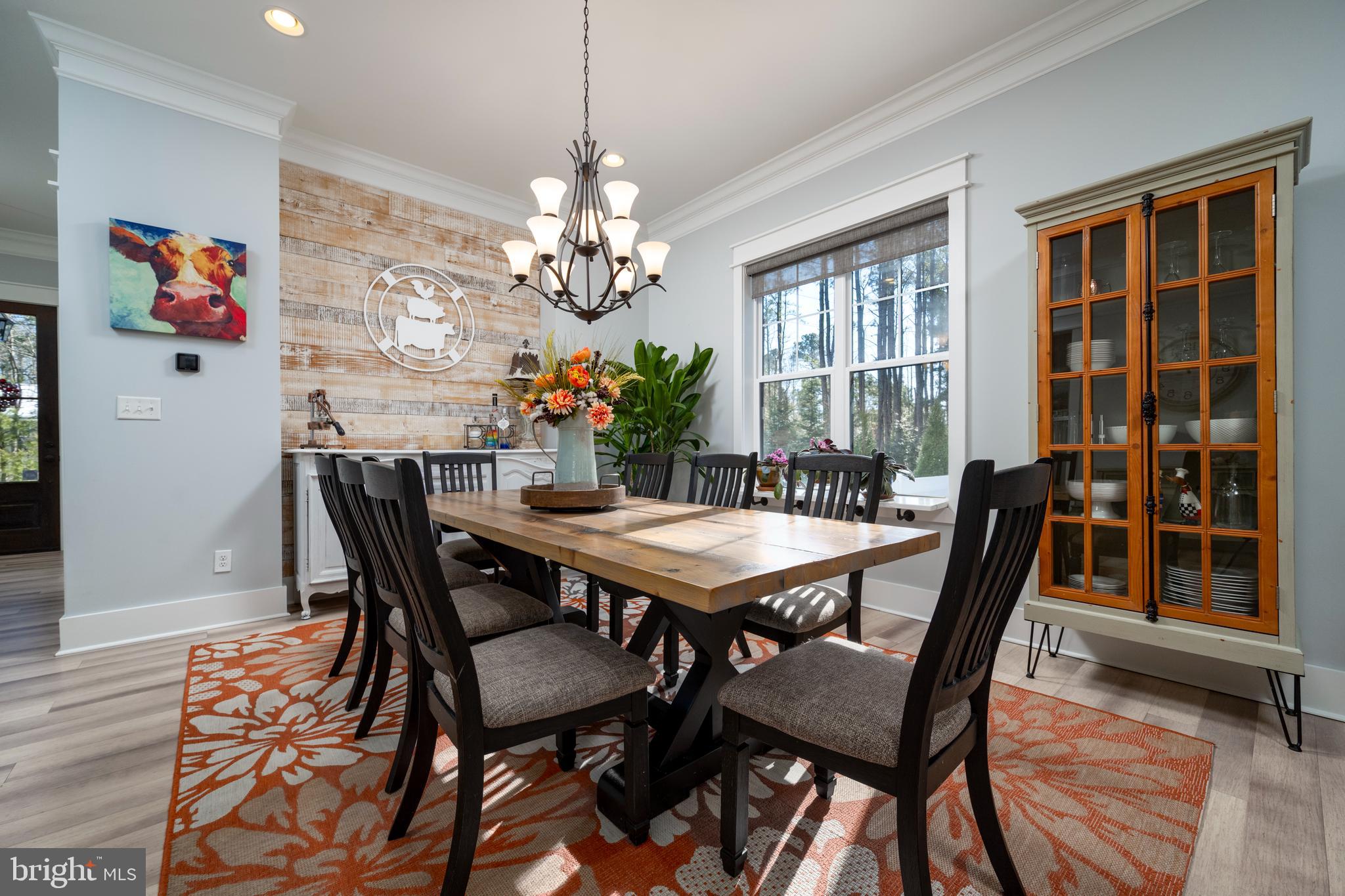 19668 Beaver Dam Road Lewes, DE 19958 - Photo 11 of 50 a view of a dining room with furniture window and wooden floor