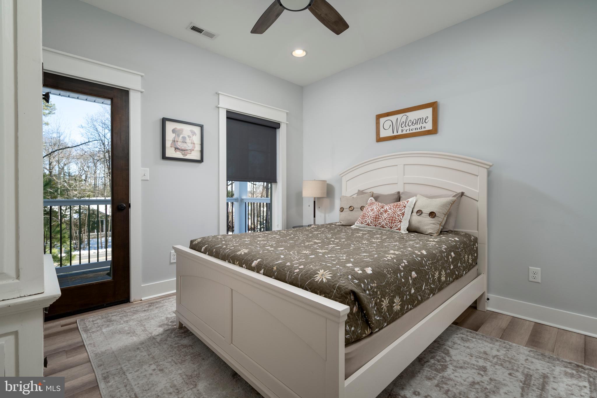 19668 Beaver Dam Road Lewes, DE 19958 - Photo 22 of 50 a bed sitting in a bedroom next to a window