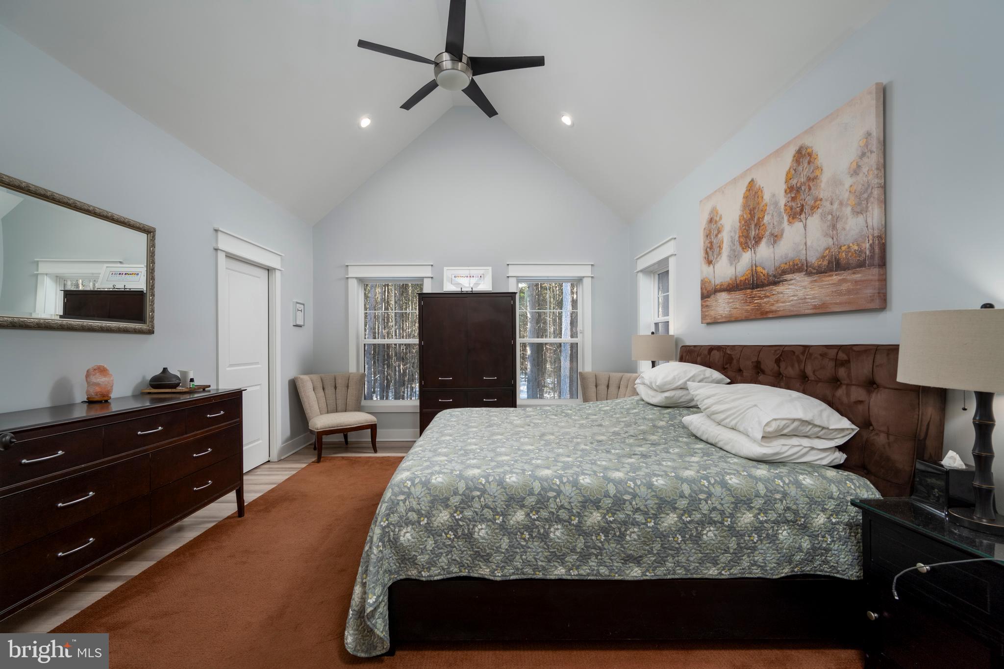 19668 Beaver Dam Road Lewes, DE 19958 - Photo 24 of 50 a bedroom with a bed and a flat screen tv