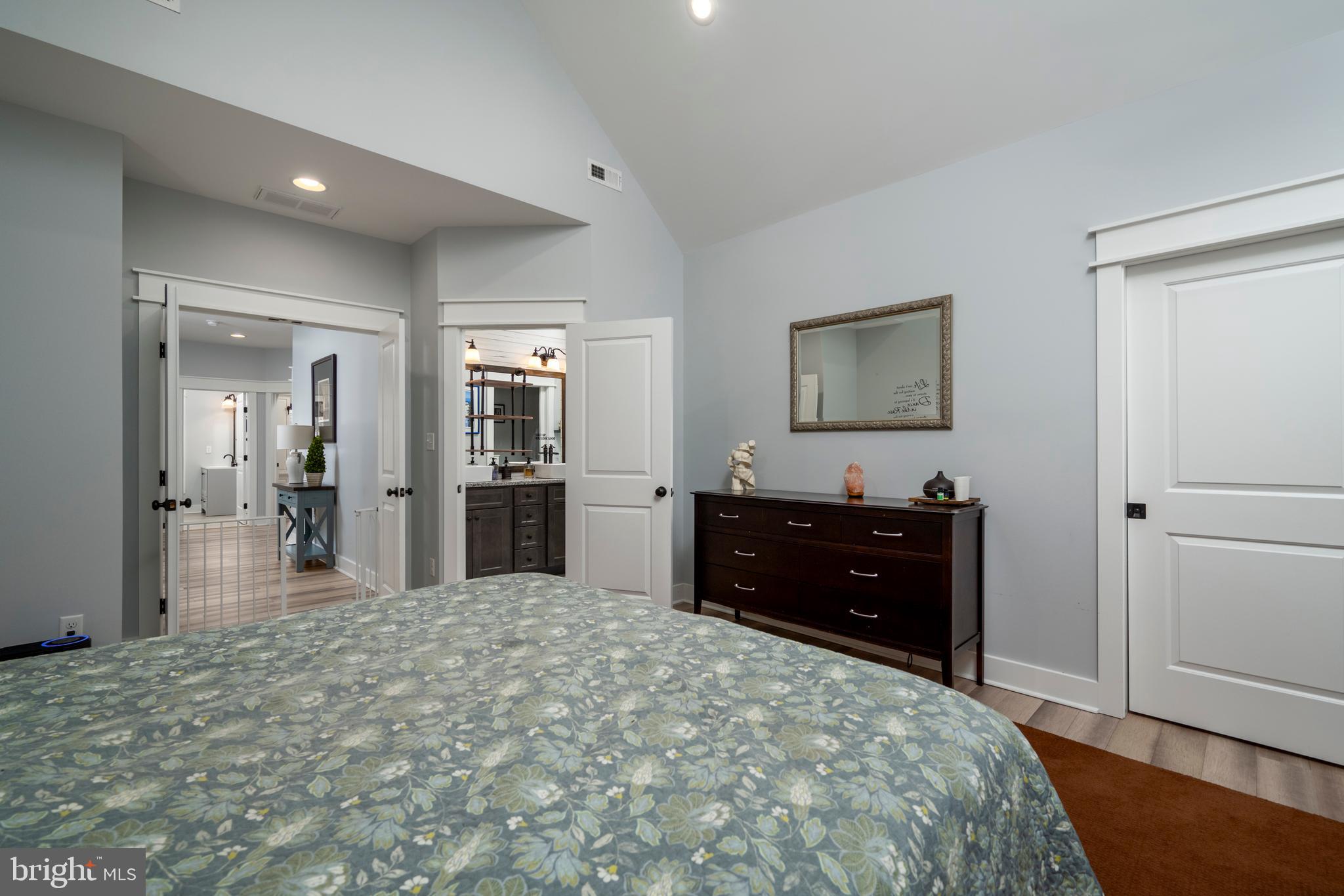 19668 Beaver Dam Road Lewes, DE 19958 - Photo 25 of 50 a bedroom with a bed and a dresser