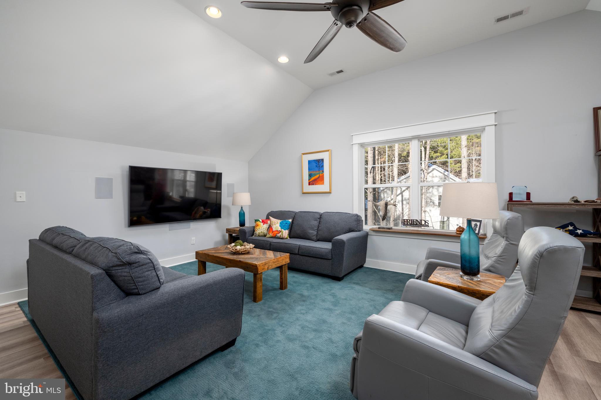 19668 Beaver Dam Road Lewes, DE 19958 - Photo 27 of 50 a living room with furniture and a flat screen tv