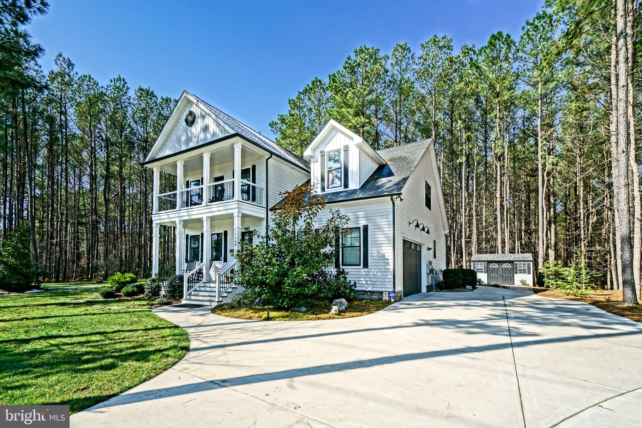 19668 Beaver Dam Road Lewes, DE 19958 - Photo 30 of 50 a front view of a house with a yard