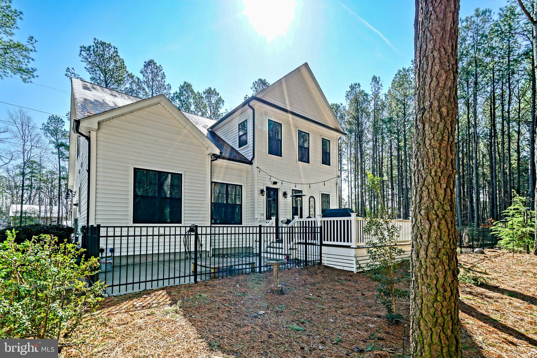 19668 Beaver Dam Road Lewes, DE 19958 - Photo 32 of 50 a house view with a garden