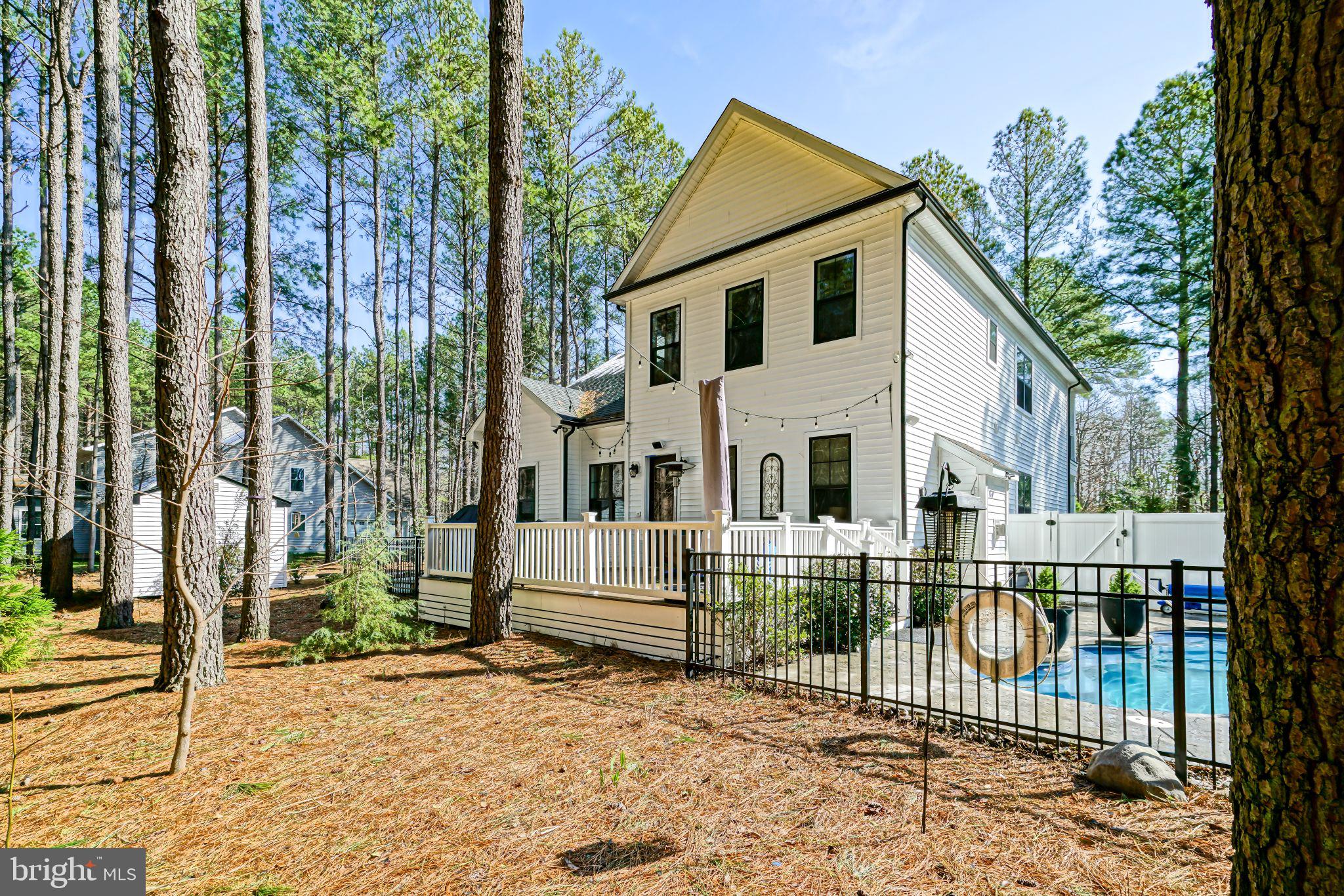 19668 Beaver Dam Road Lewes, DE 19958 - Photo 34 of 50 front view of a house with a small yard