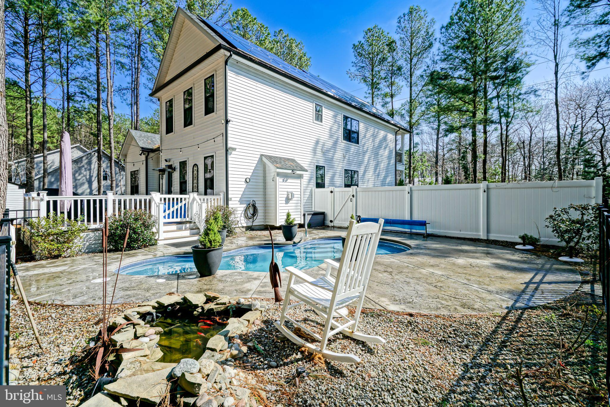 19668 Beaver Dam Road Lewes, DE 19958 - Photo 37 of 50 a view of a house with backyard and sitting area