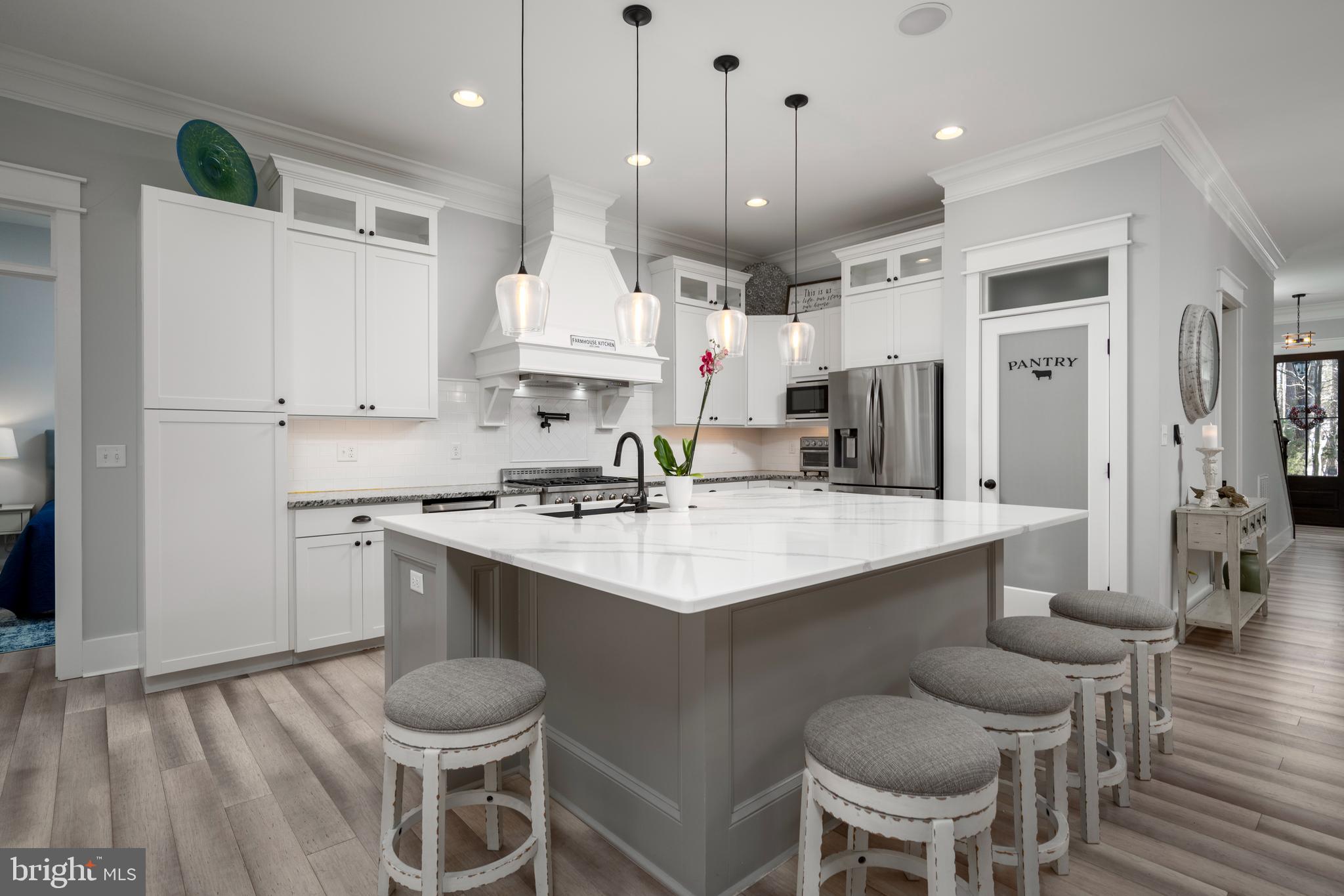 19668 Beaver Dam Road Lewes, DE 19958 - Photo 4 of 50 a kitchen with a sink stove and refrigerator