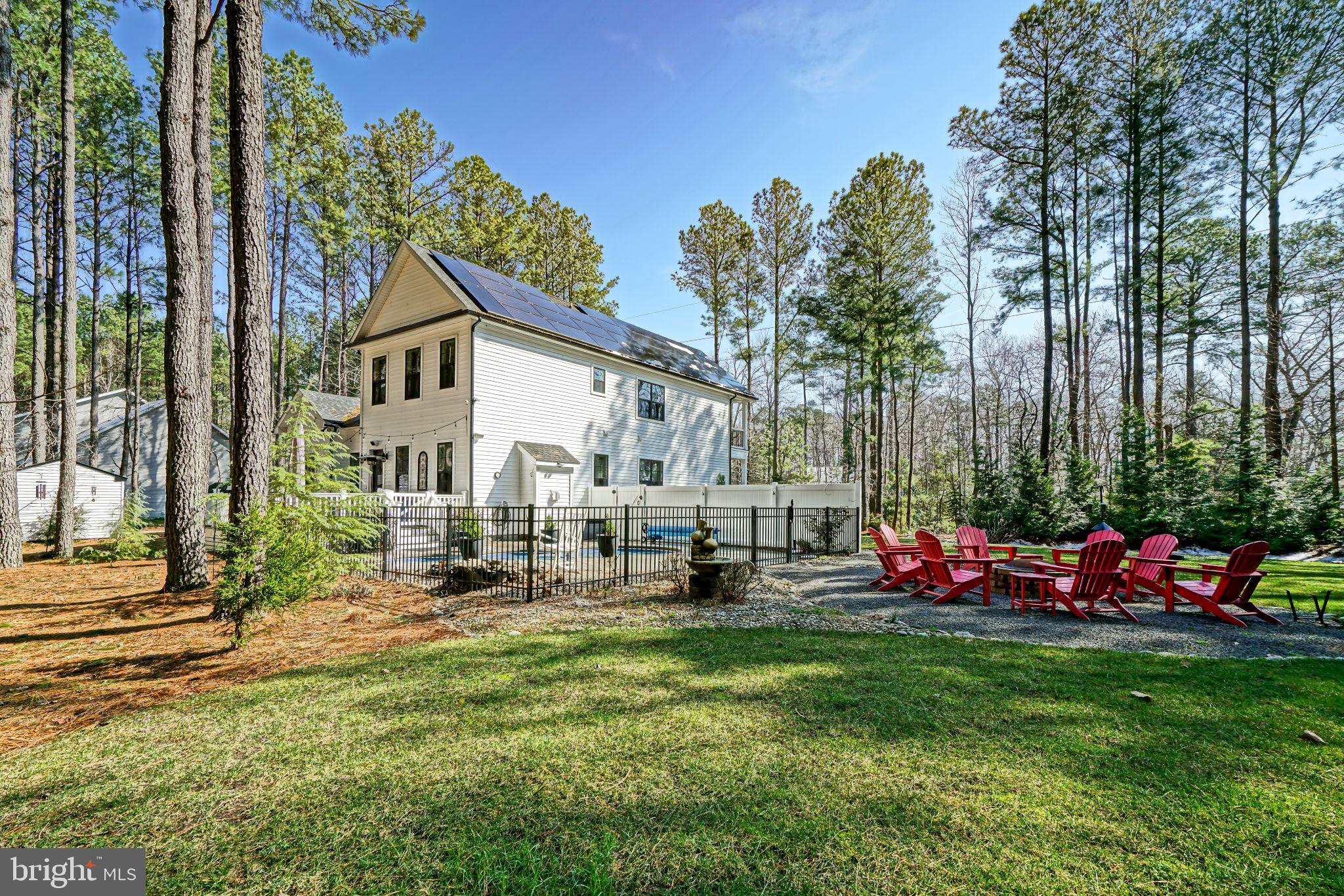19668 Beaver Dam Road Lewes, DE 19958 - Photo 43 of 50 a view of a house with backyard and sitting area