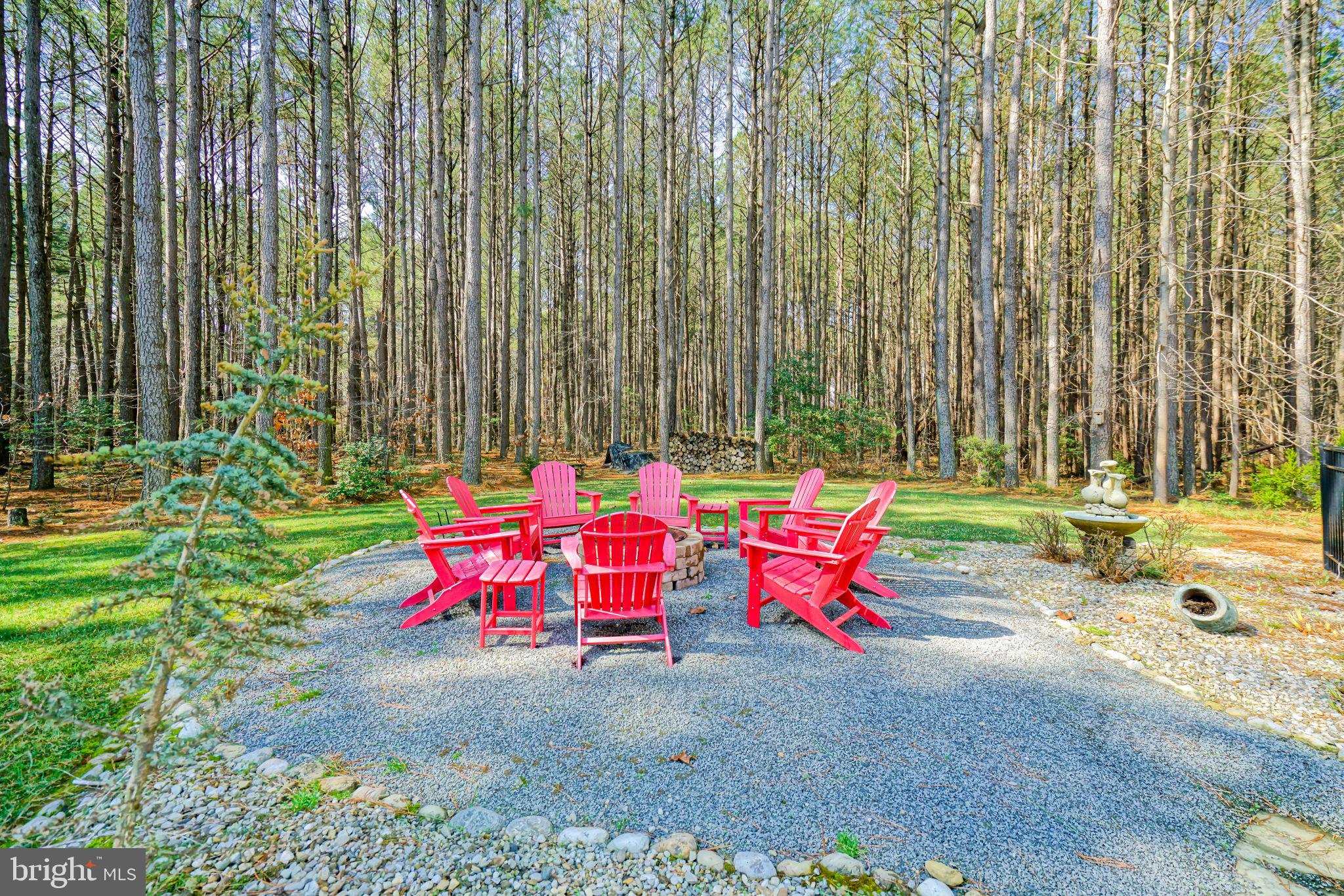 19668 Beaver Dam Road Lewes, DE 19958 - Photo 44 of 50 a view of backyard with swimming pool and outdoor seating