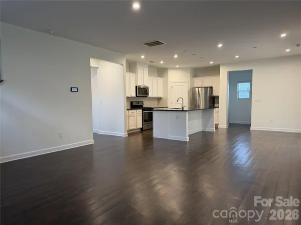 a view of kitchen with cabinets counter top space and stainless steel appliances
