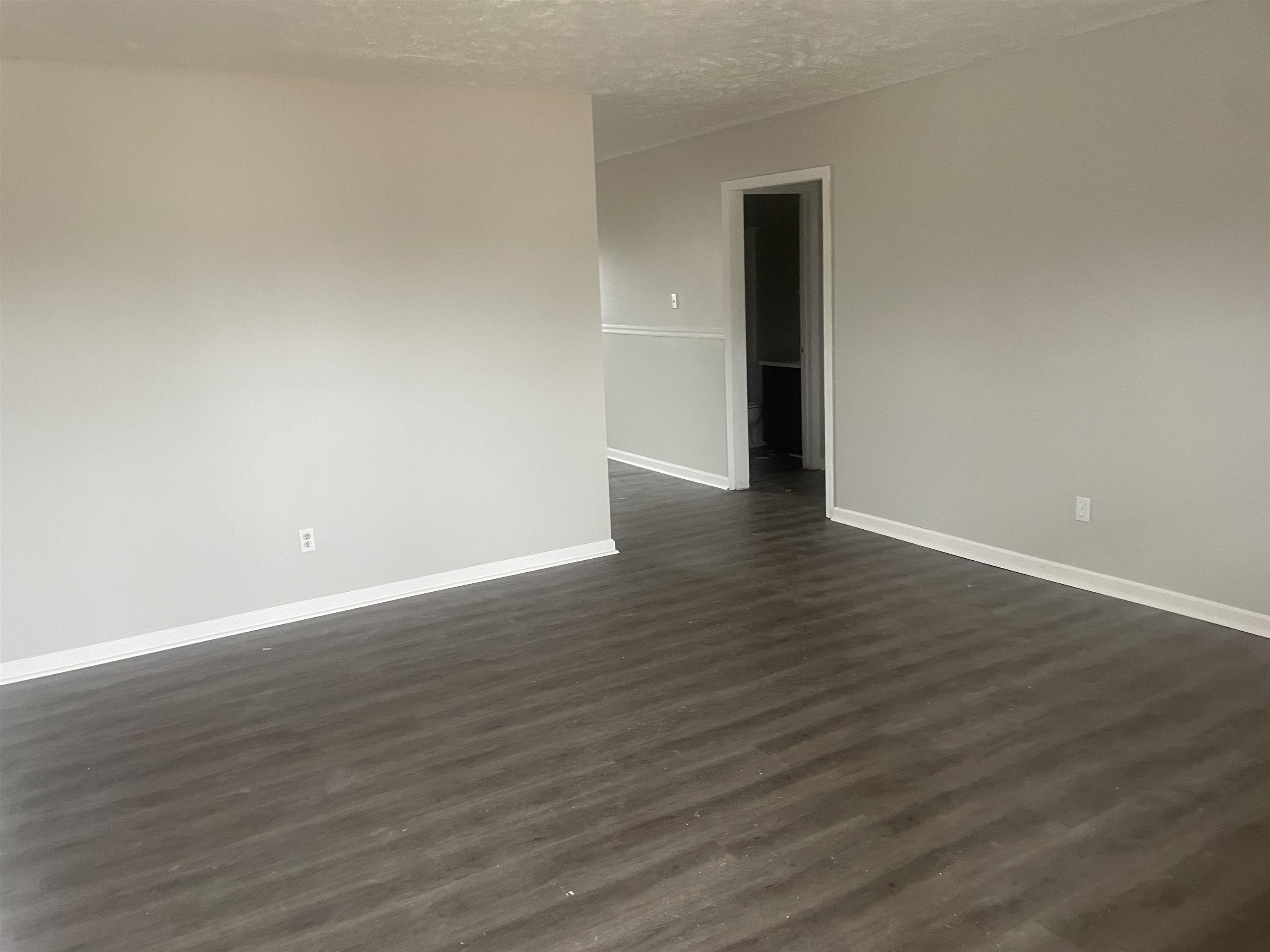 54 Cinnamon Drive Jackson, TN 38305 - Photo 7 of 7 a view of an empty room with wooden floor and closet