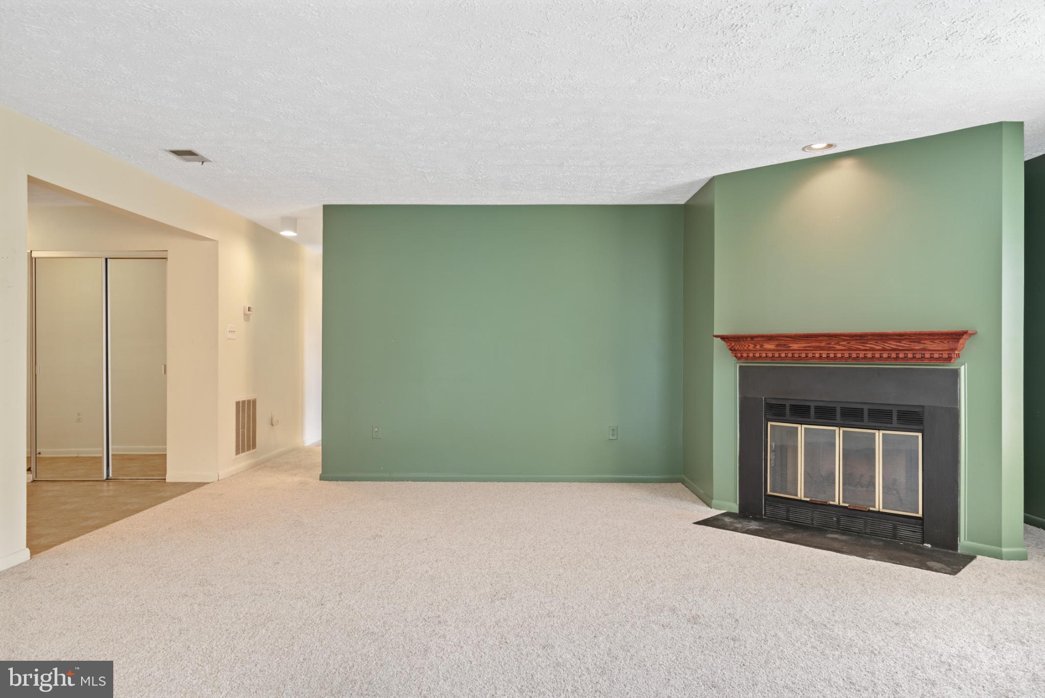 2201 Woodbox Lane, Unit 2201B Baltimore, MD 21209 - Photo 20 of 45 a view of empty room with a fireplace