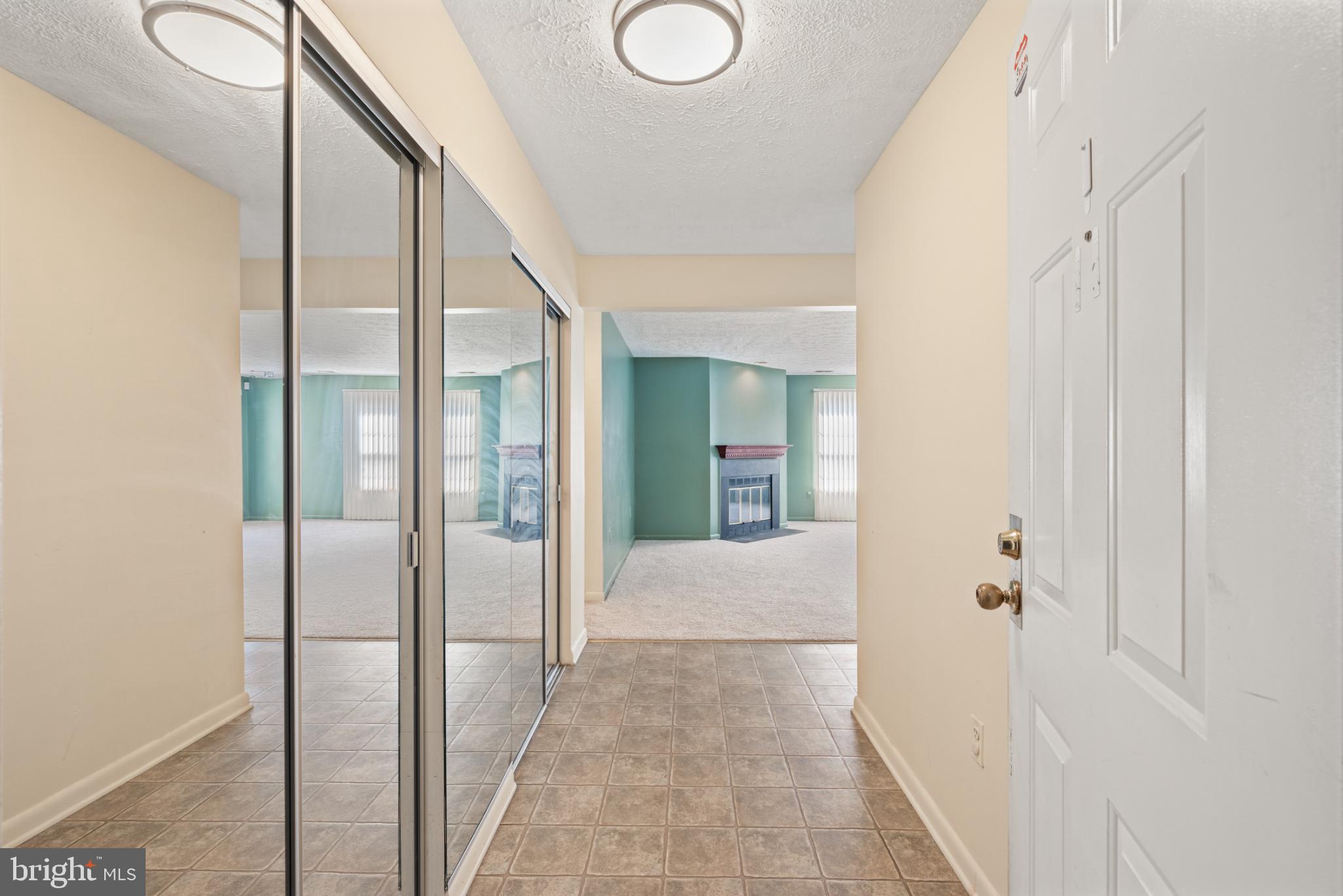 2201 Woodbox Lane, Unit 2201B Baltimore, MD 21209 - Photo 24 of 45 a view of a hallway with wooden floor and entryway