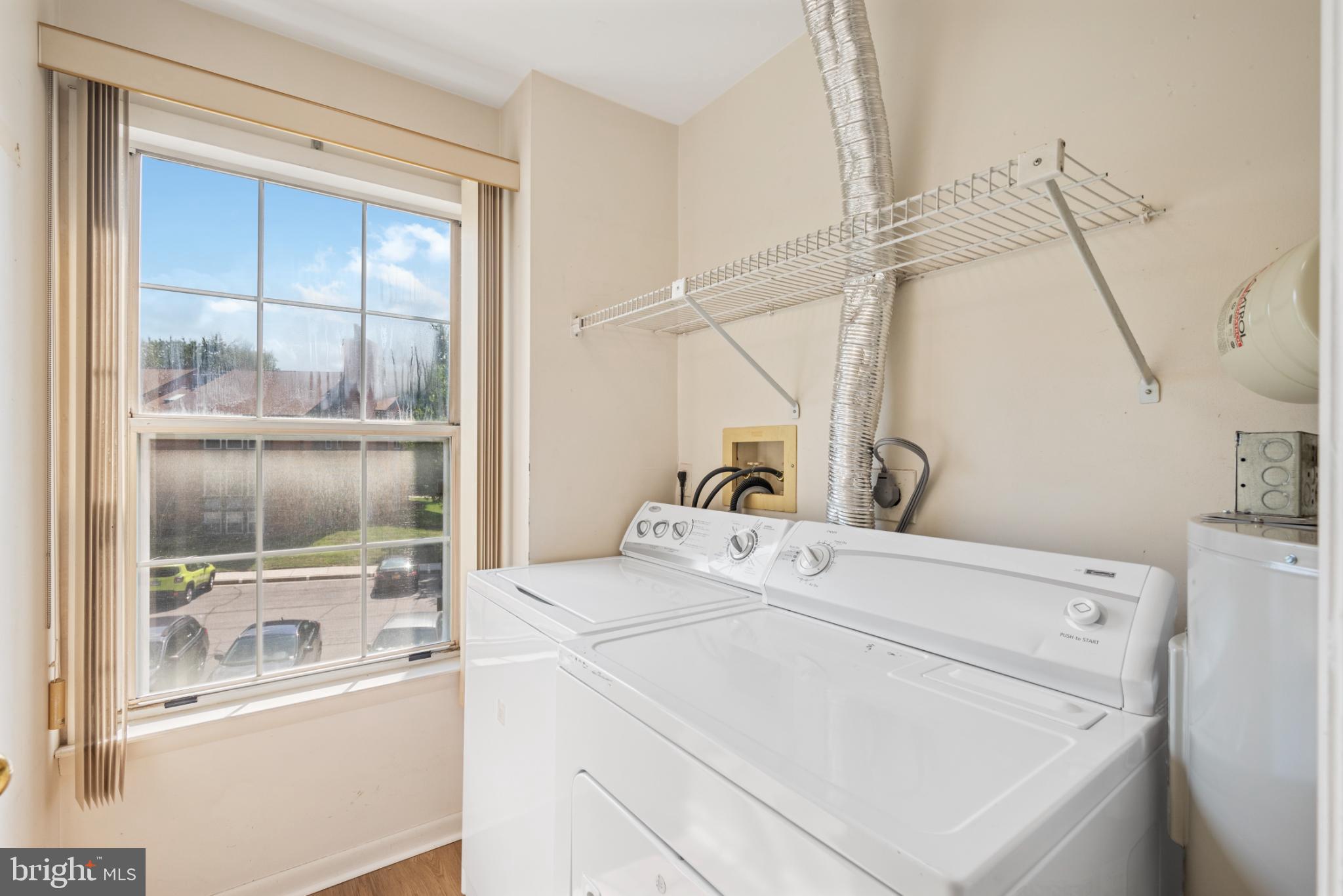 2201 Woodbox Lane, Unit 2201B Baltimore, MD 21209 - Photo 29 of 45 a utility room with dryer and washer