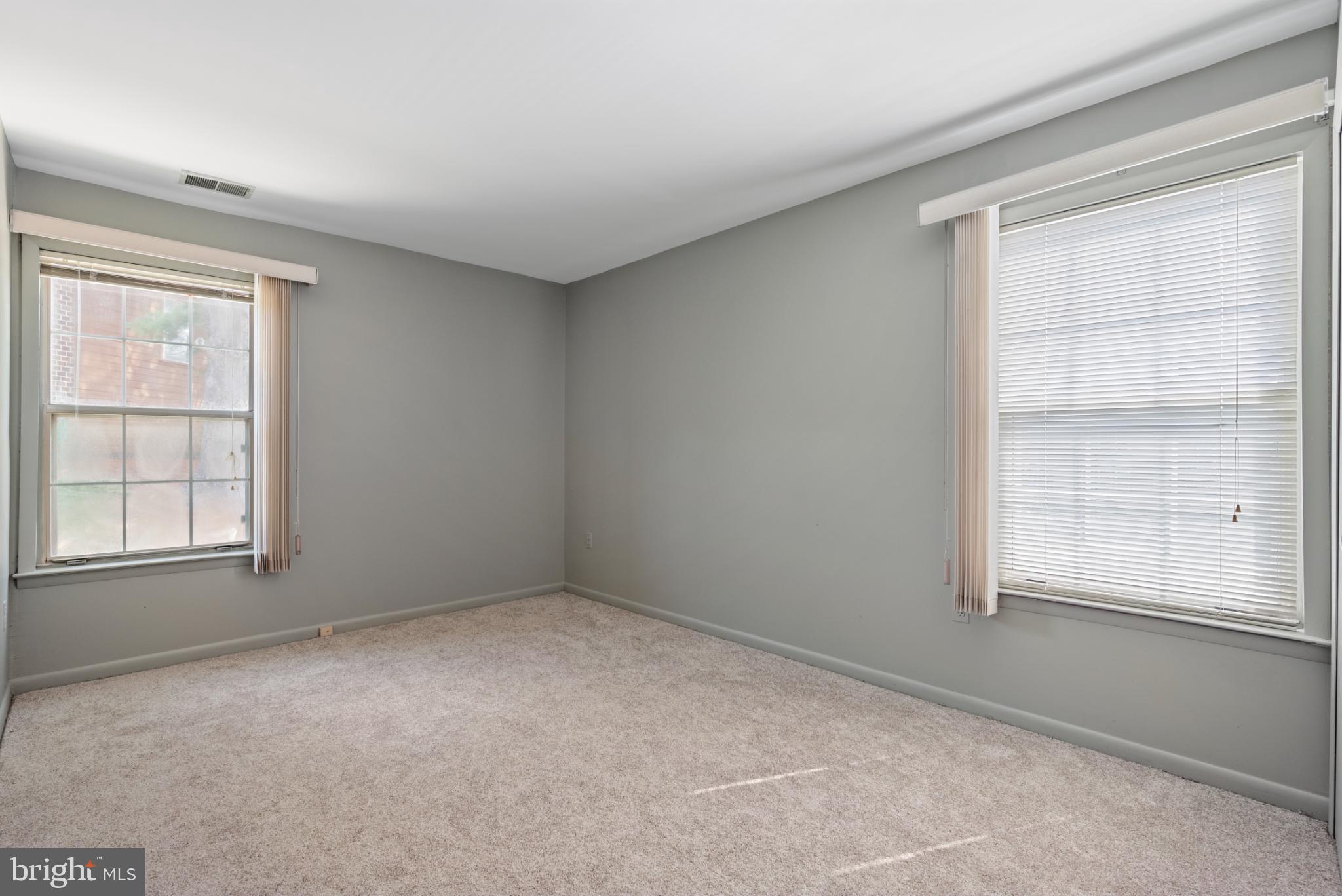 2201 Woodbox Lane, Unit 2201B Baltimore, MD 21209 - Photo 33 of 45 an empty room with windows