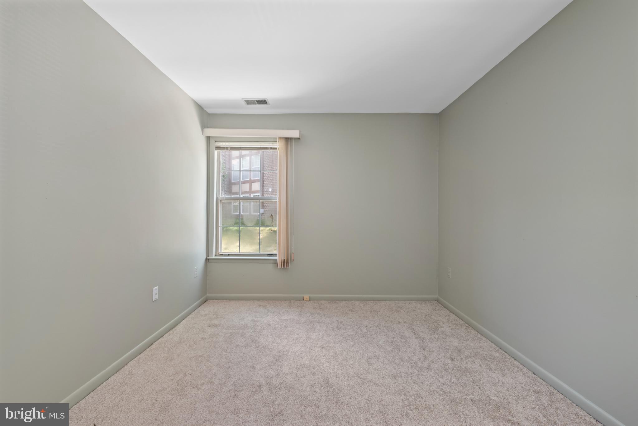 2201 Woodbox Lane, Unit 2201B Baltimore, MD 21209 - Photo 34 of 45 an empty room with a window