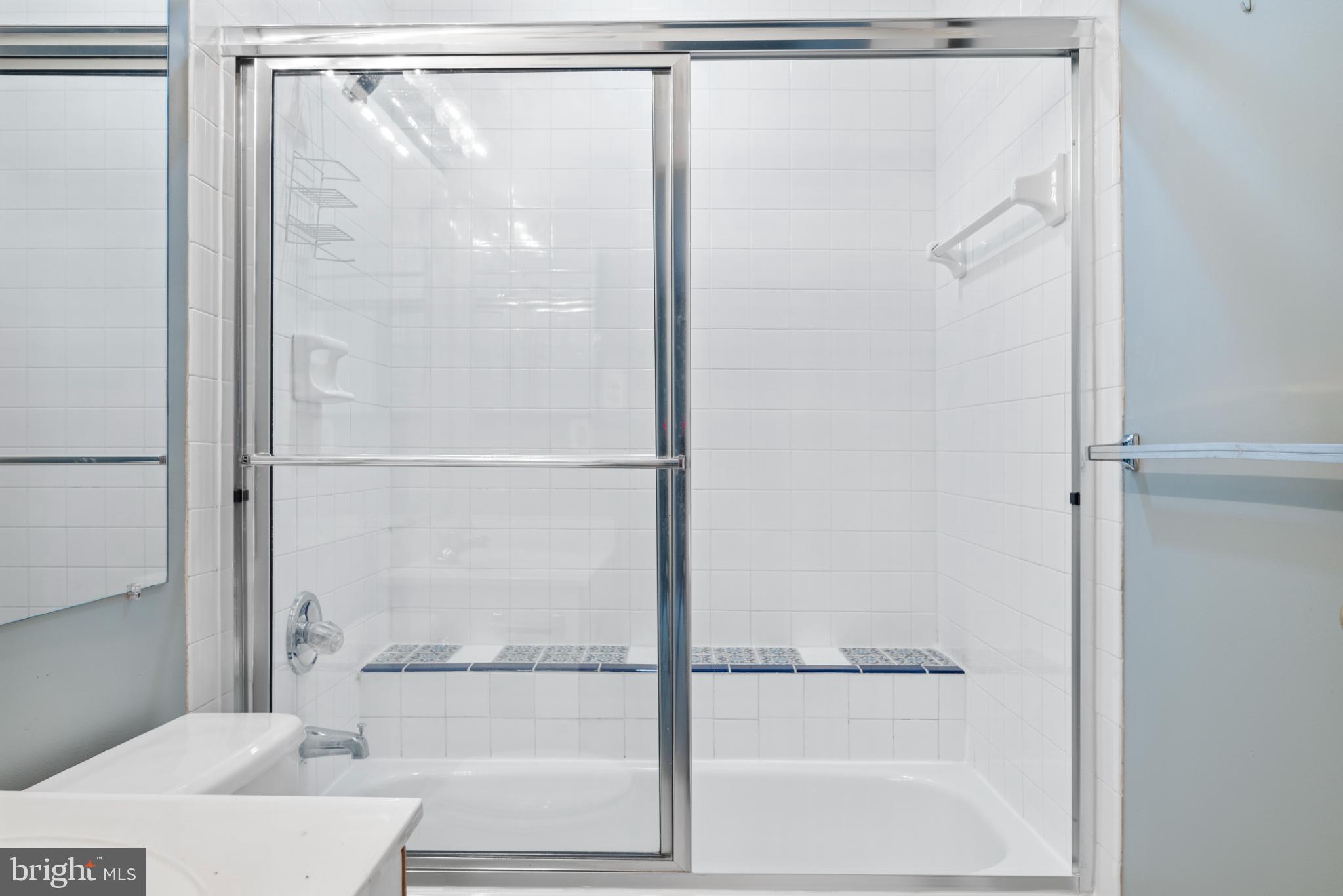 2201 Woodbox Lane, Unit 2201B Baltimore, MD 21209 - Photo 36 of 45 a bathroom with a glass shower door