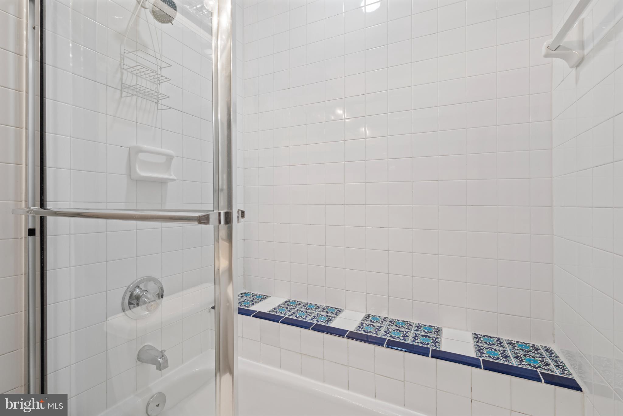 2201 Woodbox Lane, Unit 2201B Baltimore, MD 21209 - Photo 37 of 45 a bathroom with a bathtub and shower