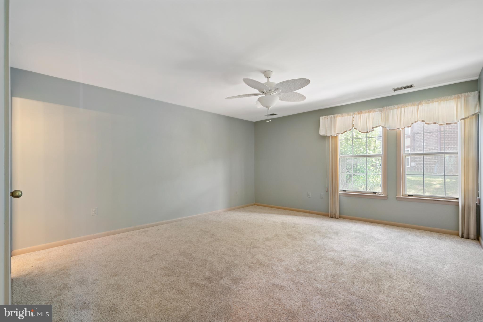 2201 Woodbox Lane, Unit 2201B Baltimore, MD 21209 - Photo 42 of 45 a view of an empty room with a window