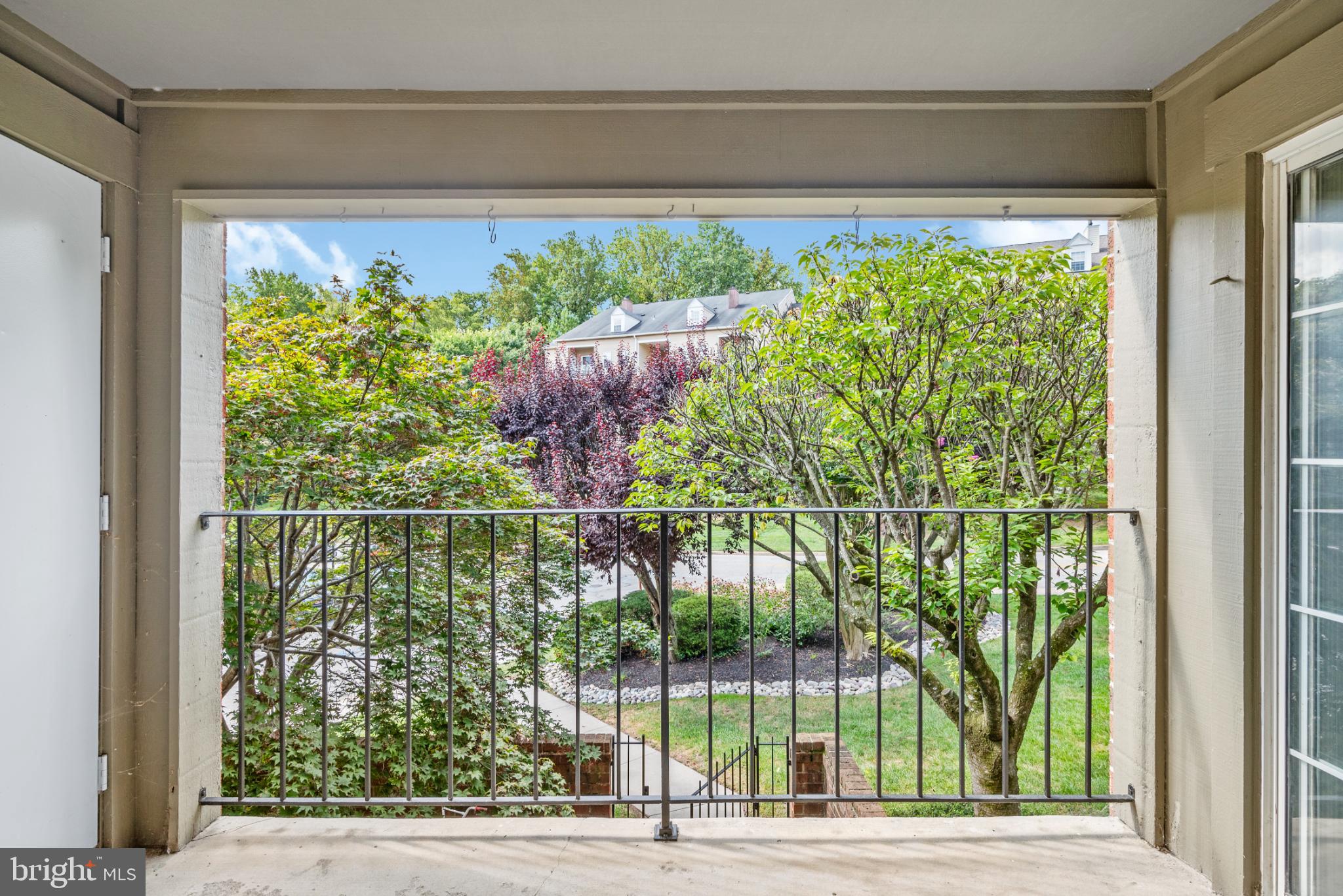 2201 Woodbox Lane, Unit 2201B Baltimore, MD 21209 - Photo 6 of 45 a view of a garden from a window