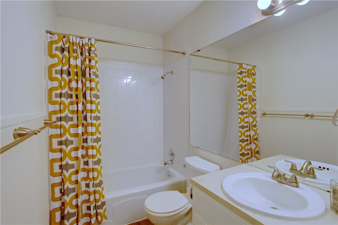 816 West N Loop Boulevard, Unit 106 Austin, TX 78756 - Photo 15 of 21 a bathroom with a sink toilet and shower