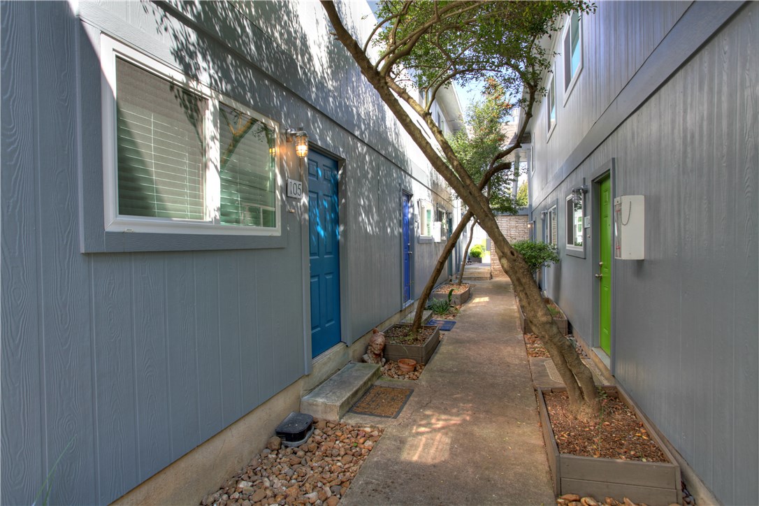816 West N Loop Boulevard, Unit 106 Austin, TX 78756 - Photo 17 of 21 a view of a pathway of a house with a tree