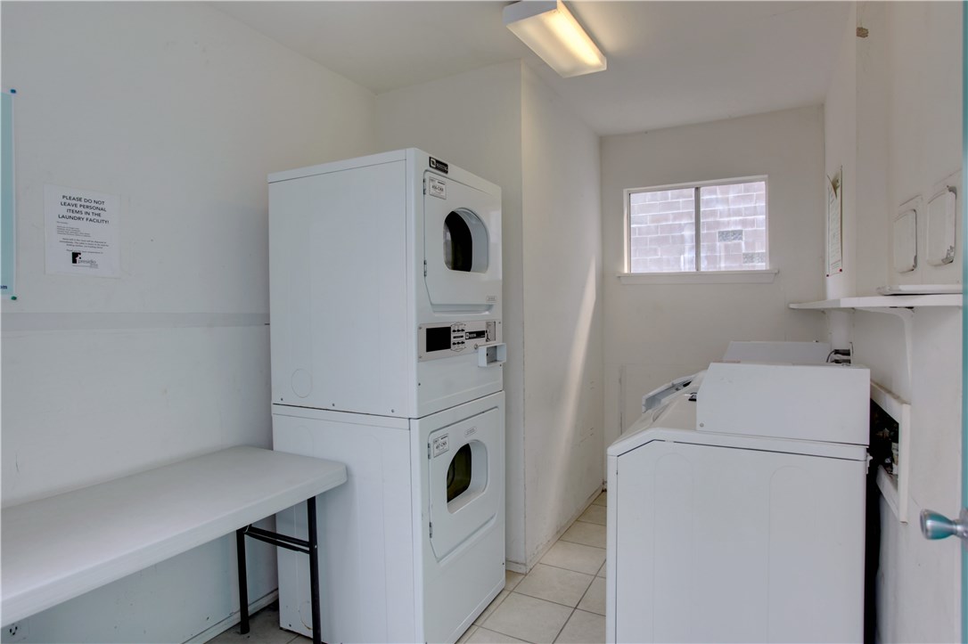 816 West N Loop Boulevard, Unit 106 Austin, TX 78756 - Photo 19 of 21 a utility room with dryer and washer