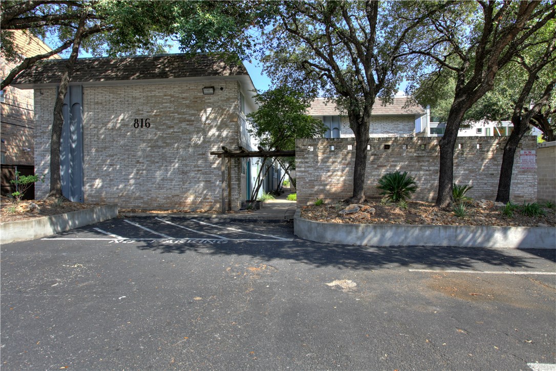 816 West N Loop Boulevard, Unit 106 Austin, TX 78756 - Photo 3 of 21 a view of a street with a tree in the background