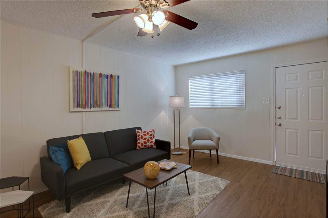816 West N Loop Boulevard, Unit 106 Austin, TX 78756 - Photo 6 of 21 a living room with furniture