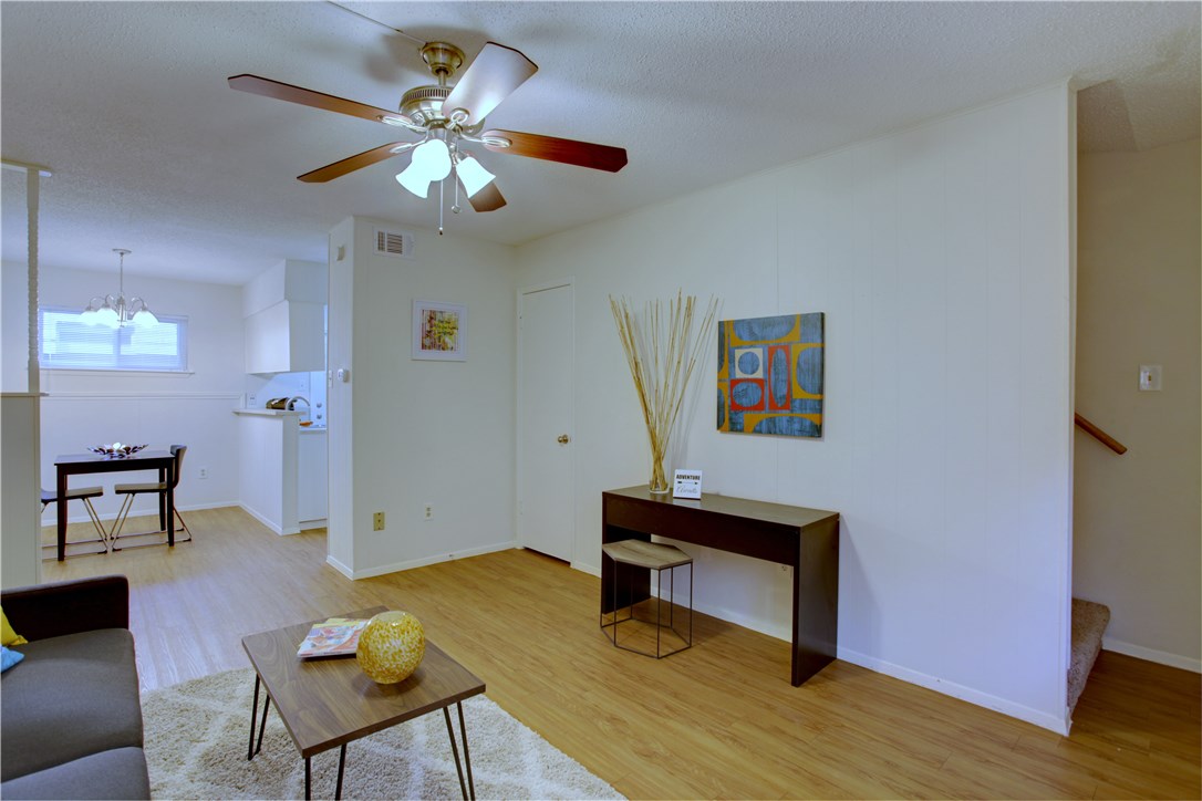 816 West N Loop Boulevard, Unit 106 Austin, TX 78756 - Photo 7 of 21 a view of a livingroom with furniture and wooden floor