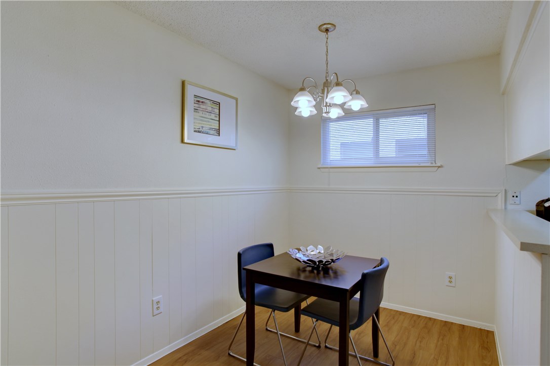 816 West N Loop Boulevard, Unit 106 Austin, TX 78756 - Photo 9 of 21 a dining room with a table and chairs