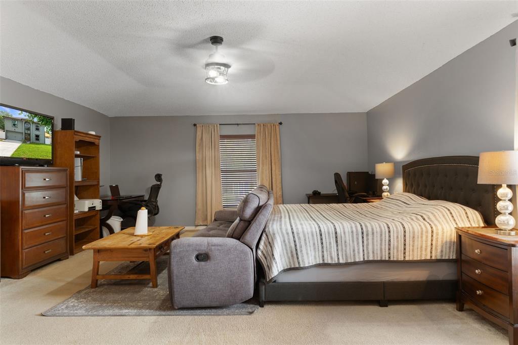 2451 Deltona Boulevard Spring Hill, FL 34606 - Photo 23 of 68 a bedroom with a bed and furniture