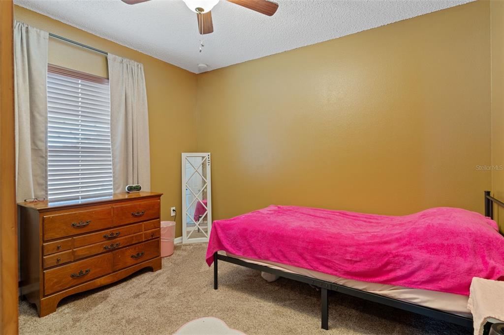 2451 Deltona Boulevard Spring Hill, FL 34606 - Photo 39 of 68 a bedroom with a bed and a window