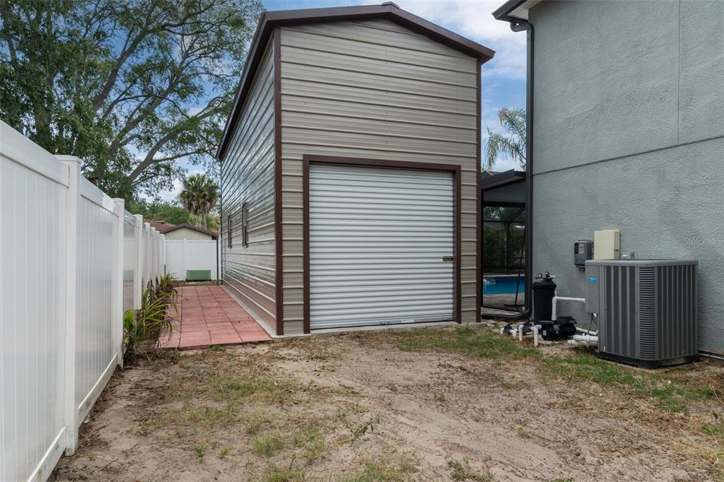 2451 Deltona Boulevard Spring Hill, FL 34606 - Photo 57 of 68 a backyard of a house