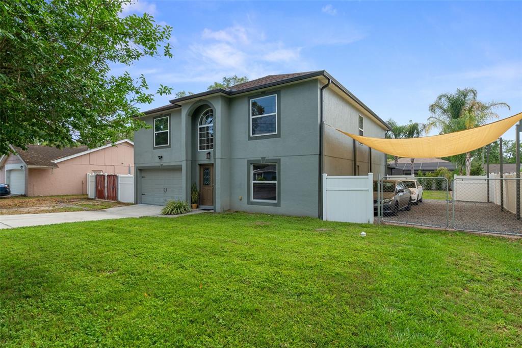 2451 Deltona Boulevard Spring Hill, FL 34606 - Photo 64 of 68 a view of a house with a yard