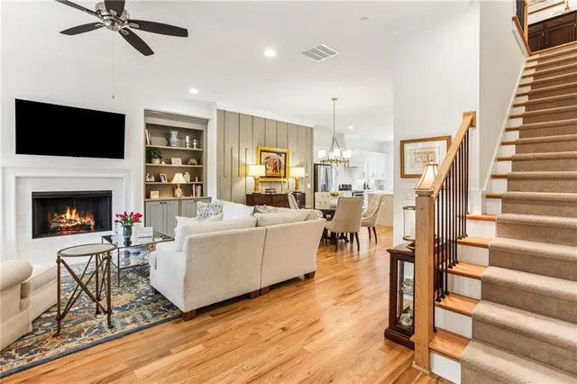 a living room with furniture fireplace and flat screen tv