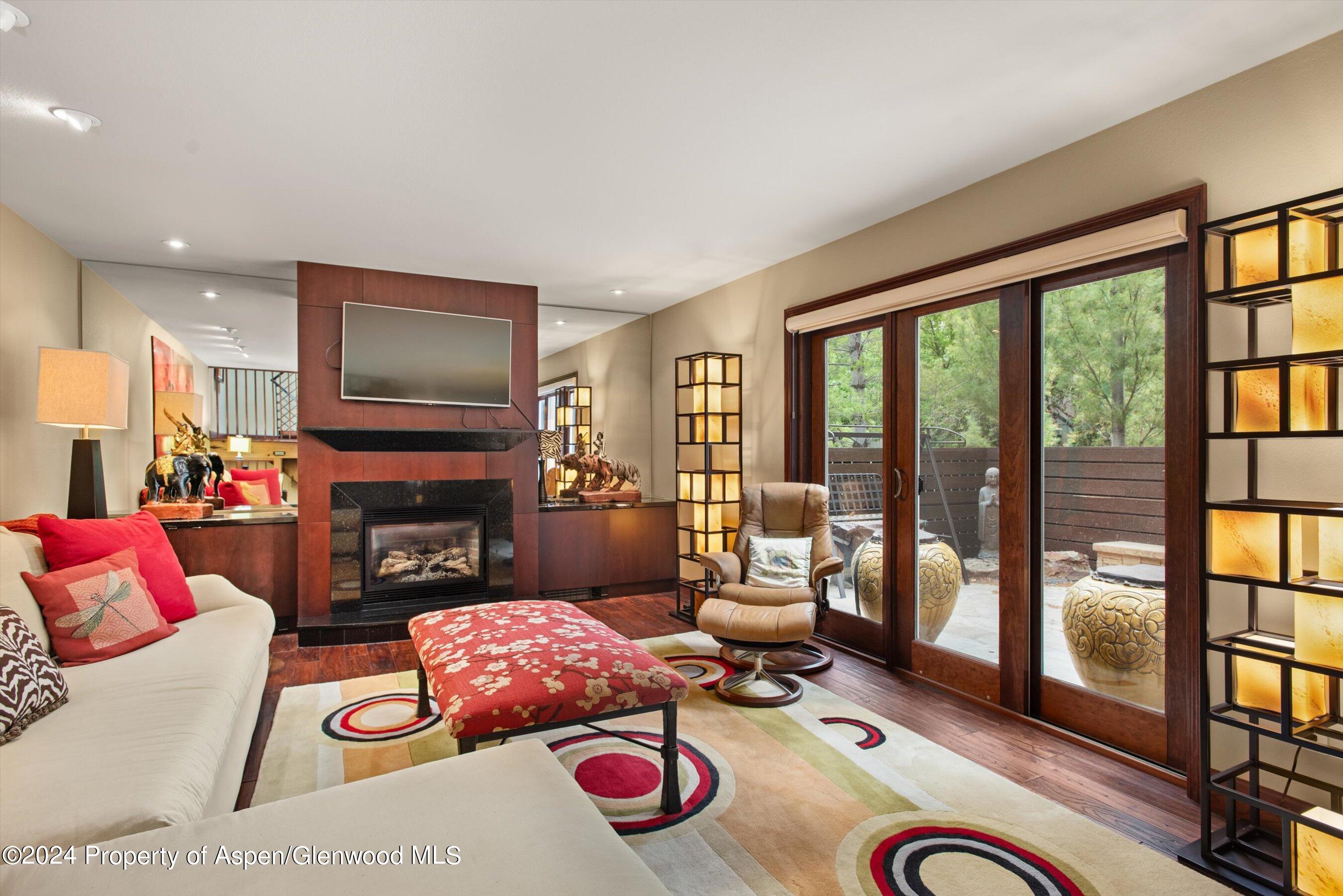 153 Wren Court Basalt, CO 81621 - Photo 1 of 21 a living room with furniture or floor to ceiling window and a flat screen tv
