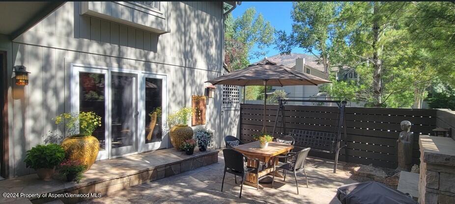 153 Wren Court Basalt, CO 81621 - Photo 3 of 21 a view of a patio with table and chairs potted plants with wooden floor