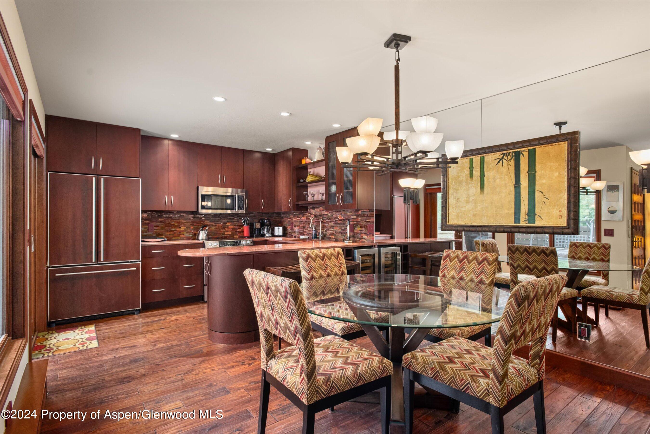 153 Wren Court Basalt, CO 81621 - Photo 7 of 21 a view of a dining room with furniture window and wooden floor