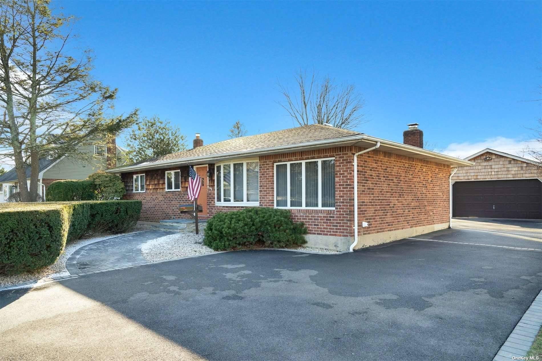 8 Terry Lane Commack, NY 11725 - Photo 1 of 1 a front view of a house with a yard