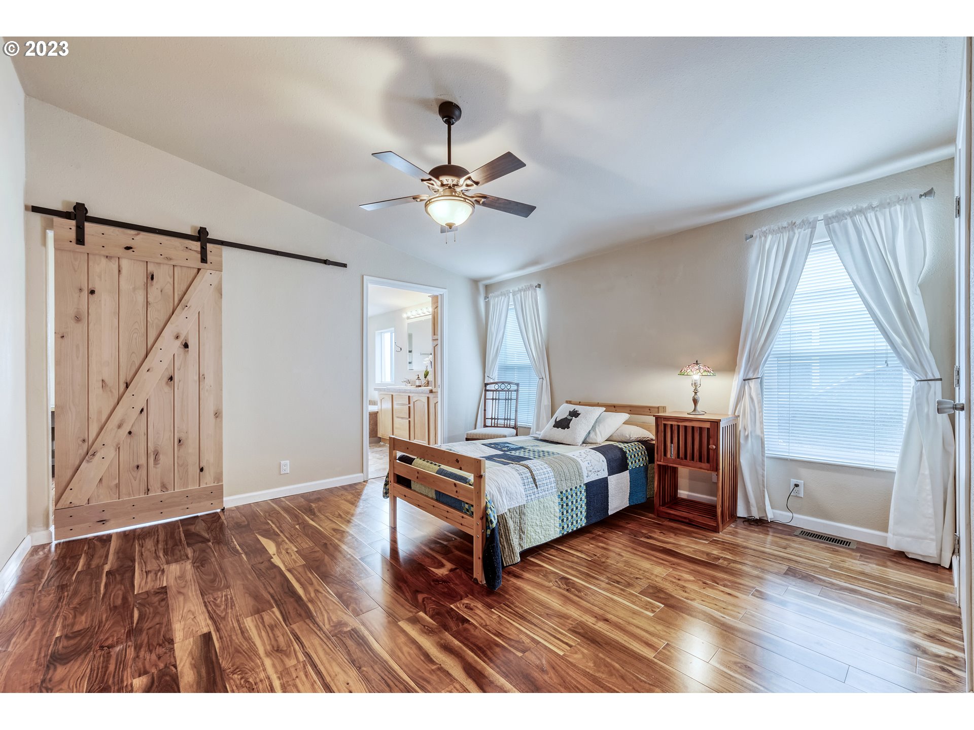 2601 Maia Loop Springfield, OR 97477 - Photo 16 of 29 a bedroom with a bed and a ceiling fan