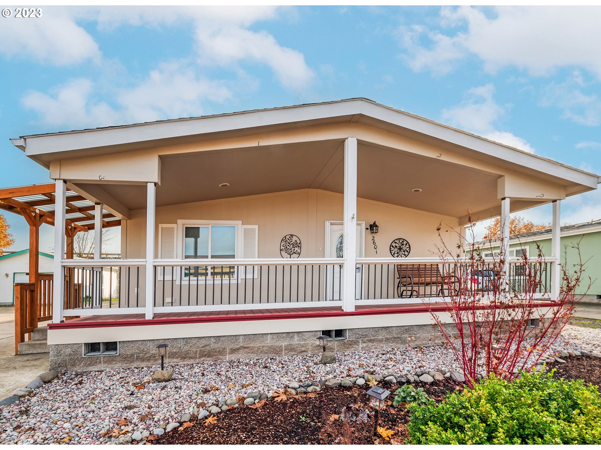 2601 Maia Loop Springfield, OR 97477 - Photo 2 of 29 a front view of a house with garden and porch