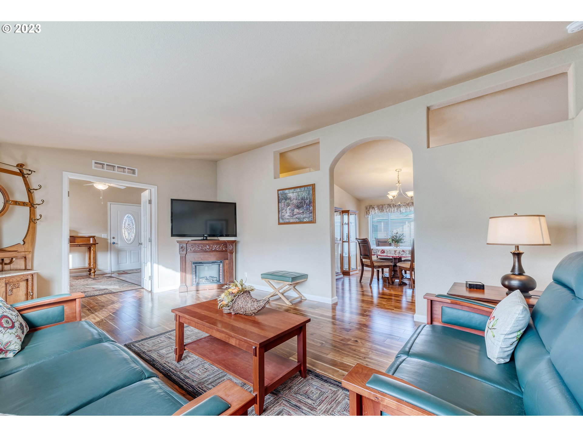 2601 Maia Loop Springfield, OR 97477 - Photo 7 of 29 a living room with furniture and a flat screen tv