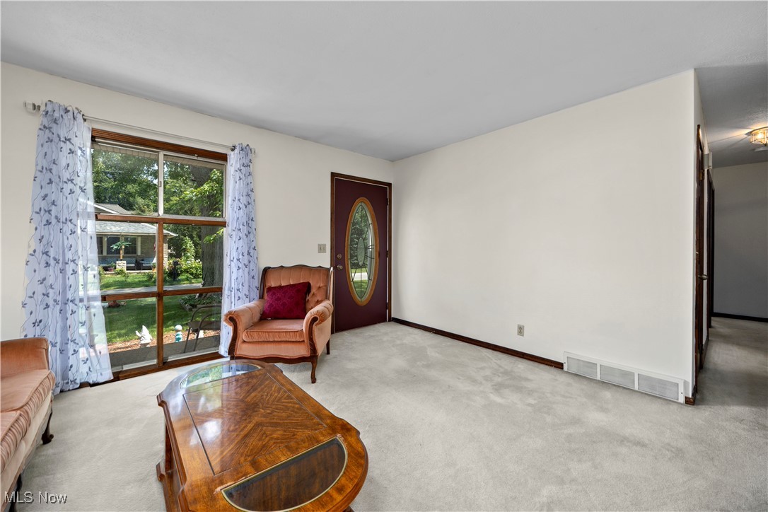 319 Ironwood Road Huron, OH 44839 - Photo 14 of 32 Carpeted living room featuring baseboards