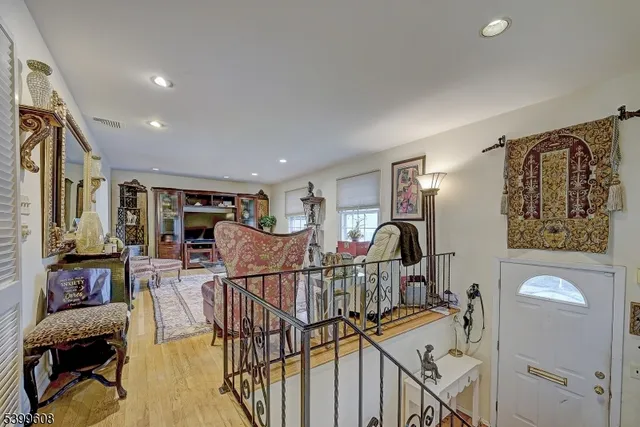 a view of a livingroom with furniture and workspace